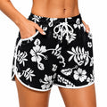 Short da donna L in tessuto sintetico nero e bianco con stampa floreale - vita elastica e tasche